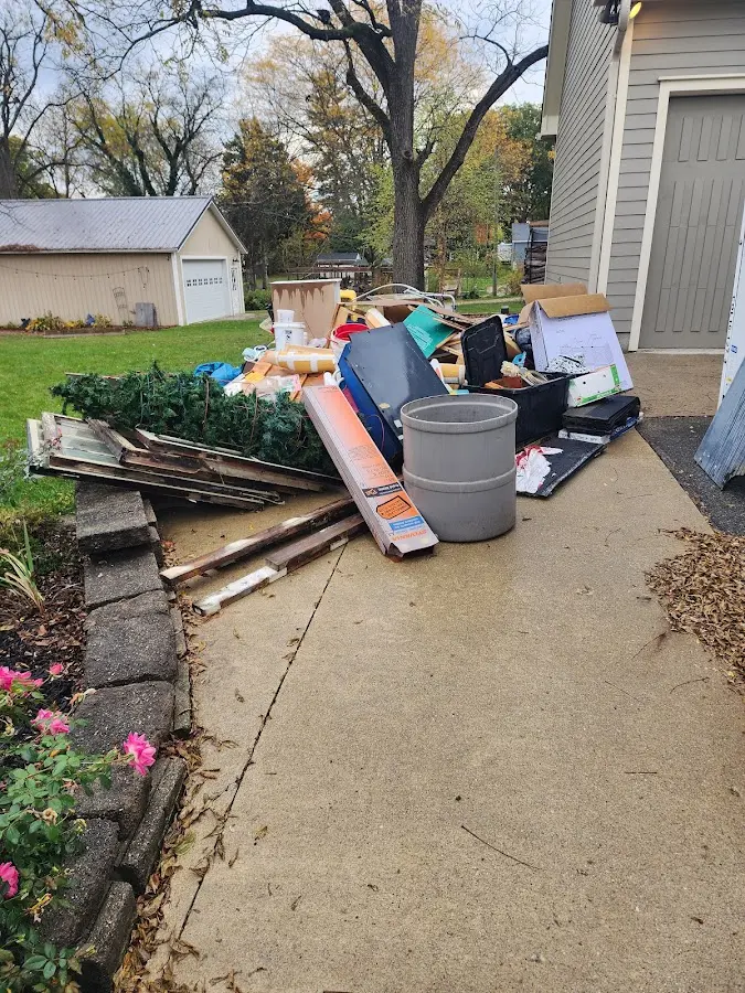 Dumpster being loaded with debris for 3 Yard Dumpster Rental in Alpharetta
